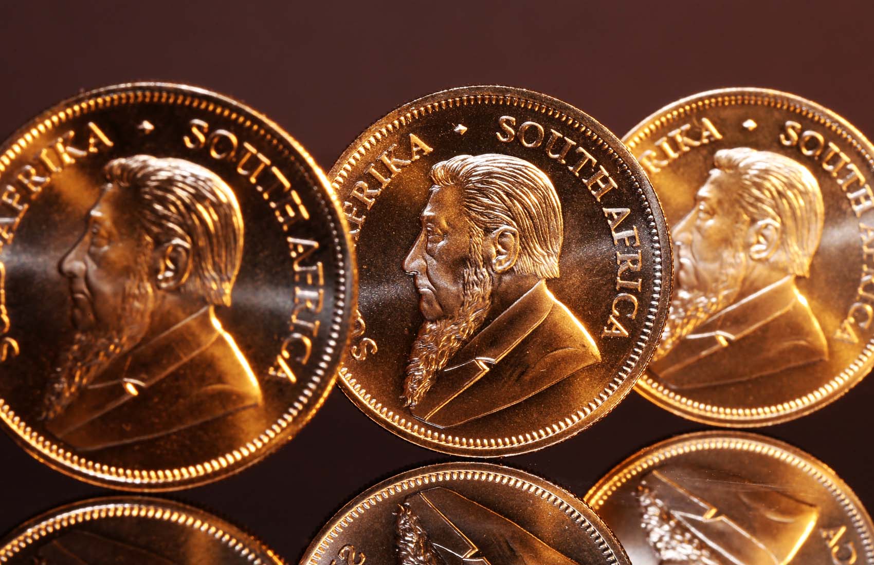 Suttons-Krugerrand-Banner-APR-2025 Three gold Krugerrands